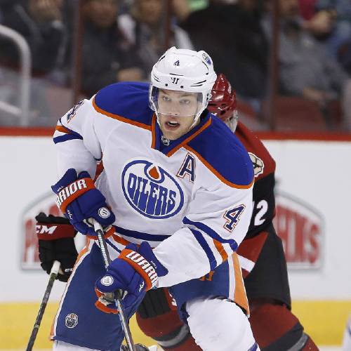 Edmonton Oilers&#039 Taylor Hall skates with the puck against the Arizona Coyotes during the first period of an NHL hockey game in Glendale Ariz. The New Jersey Devils have acquired former No. 1 overall