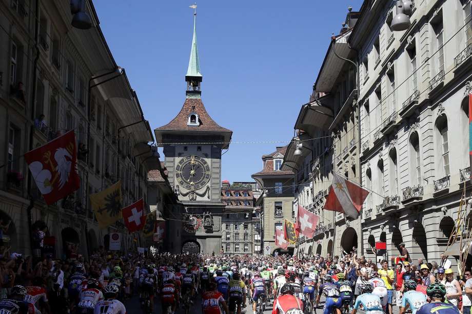 The peloton rides through downtown during stage seventeen of the 2016 Le Tour de France a 184.5km stage from Berne to Finhaut Emosson