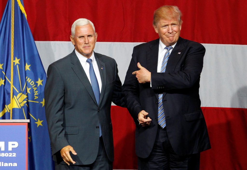 Republican presidential candidate Donald Trump and Indiana Governor Mike Pence wave to the crowd before addressing the crowd during a campaign stop at the Grand Park Events Center in Westfield Indiana