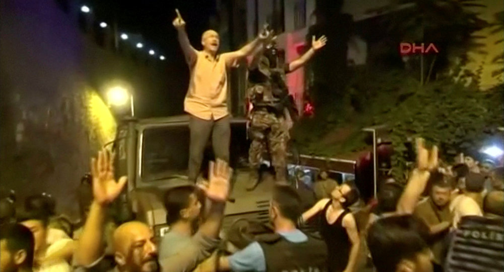 Still Frame Taken From Video Shows A Soldier And A Man On A Military Vehicle trying to calm AK Party Supporters During An Attempted Coup In Istanbul