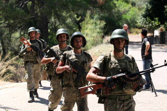 Turkish soldiers search for missing military personnel suspected of being involved in the coup attempt in Marmaris