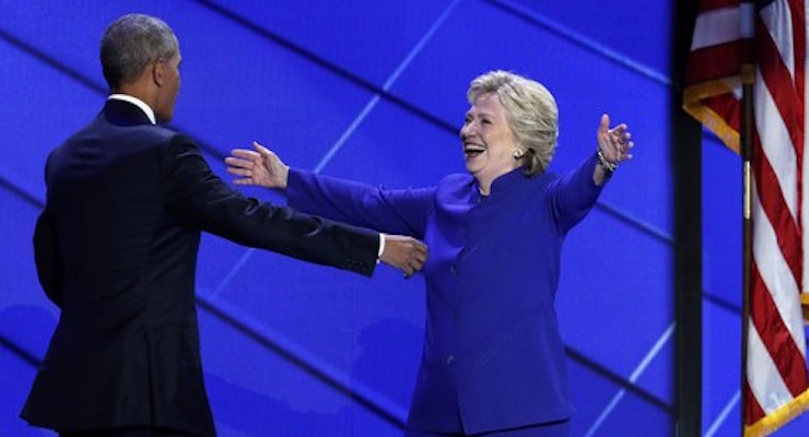 Democratic President Barack Obama left embraces Hillary Clinton right after speaking to the Democratic National Convention at the Wells Fargo Arena in Philadelphia