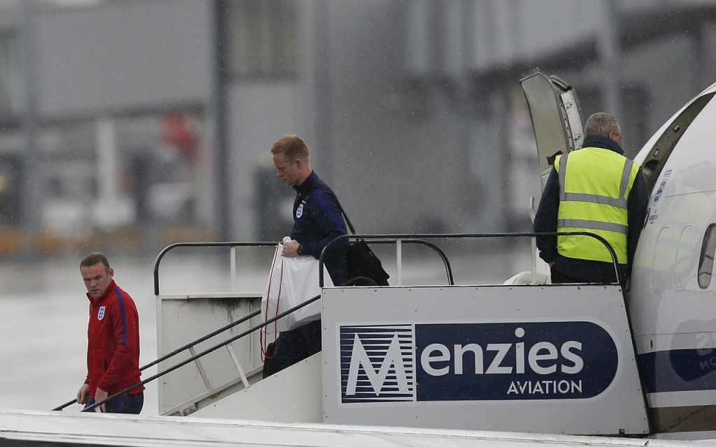 Wayne Rooney arriving at Manchester Airport after England was knocked out of the Euro 2016 tournament