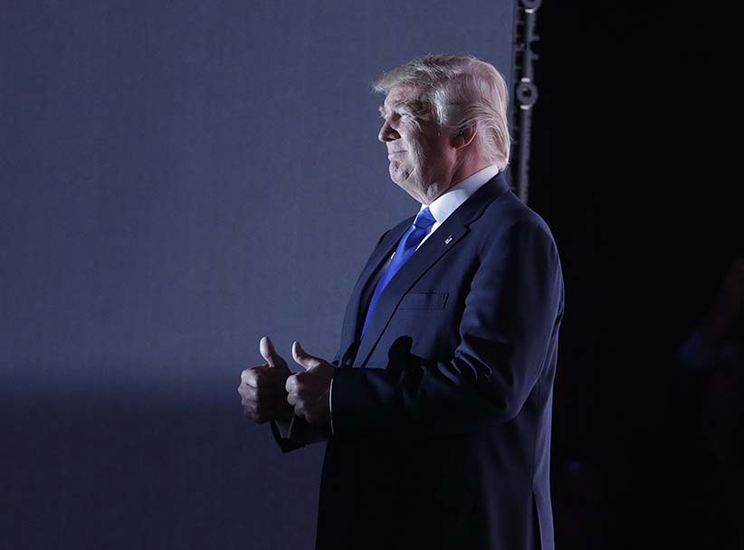 Republican Presidential Candidate Donald Trump walks to the stage during first day of the Republican National Convention in Cleveland Monday