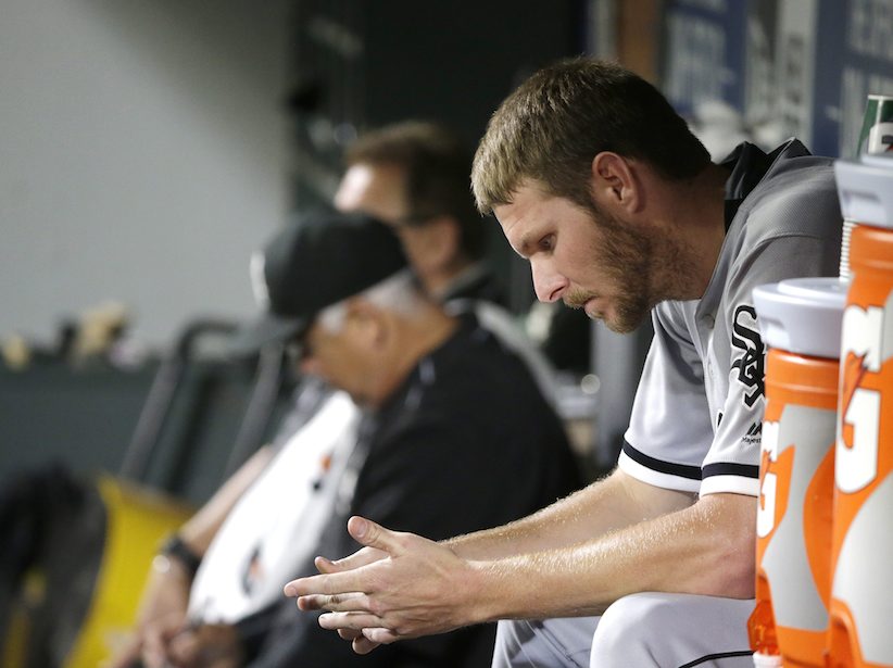 Chicago White Sox pitcher Chris Sale sits in the dugout after he threw eight shutout innings against the Seattle Mariners giving up one hit in a baseball game Monday