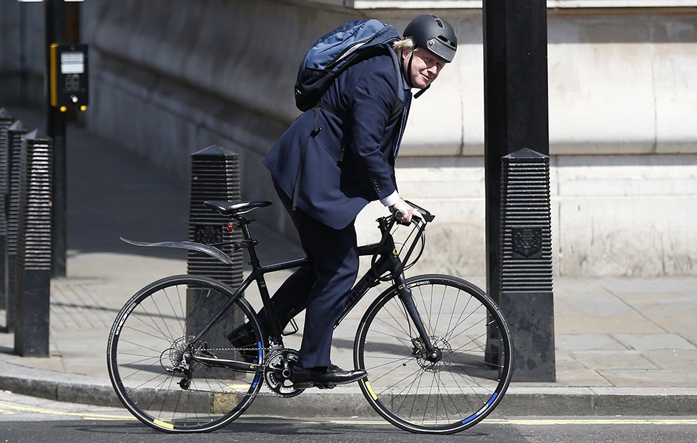 Boris Johnson rides his bike along Whitehall in London earlier this month. Instead of choosing a team player for the nation's top diplomatic post Theresa May has chosen a politician who prides himself on being different