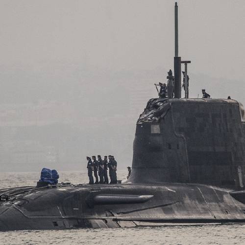 British Royal Navy submarine HMS Ambush's arrives into the Naval Base at Gibraltar. A British Royal Navy submarine has been forced into port after colliding with a merchant vessel off the coast of Gibraltar
