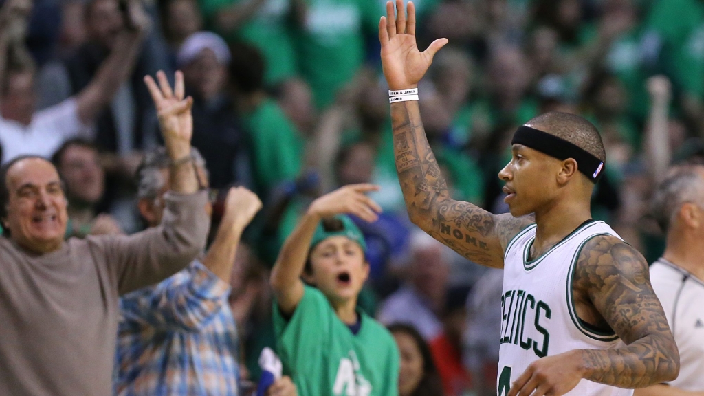 Boston Celtics&#039 Isaiah Thomas fires up fans after hitting a three pointer against the Atlanta Hawks during the third period in Game 4 of a first-round NBA basketball playoff series in Boston on Sunday