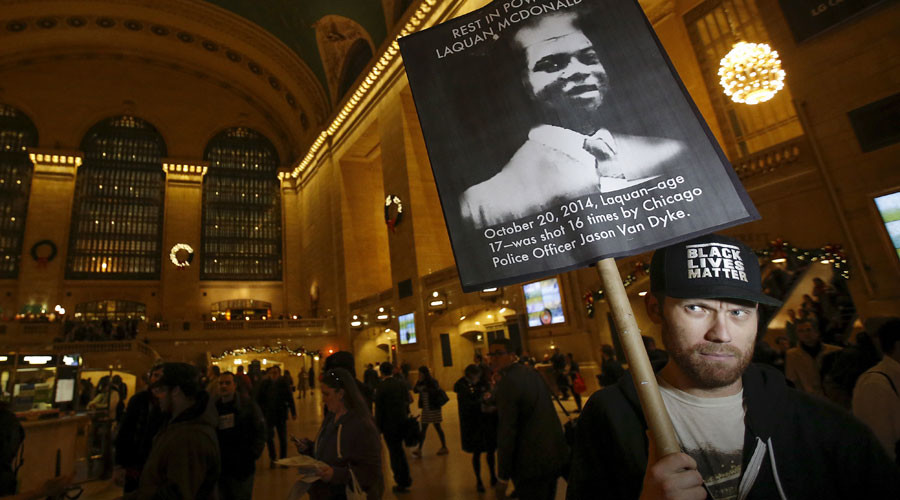 A Black Lives Matter protester demonstrates the police killing of Laquan McDonald