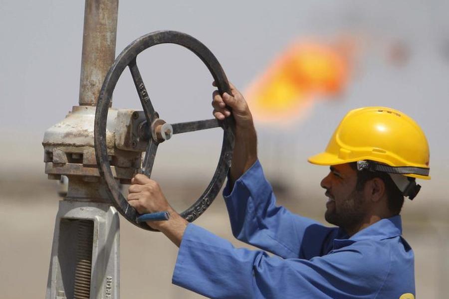 A worker adjusts a pipe at the Nassiriya oilfield in Nassiriya                
                
                  Reuters  Atef Hassan