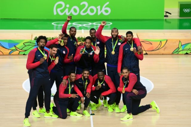 From L The members of the USA men's basketball team celebrate with their gold medals