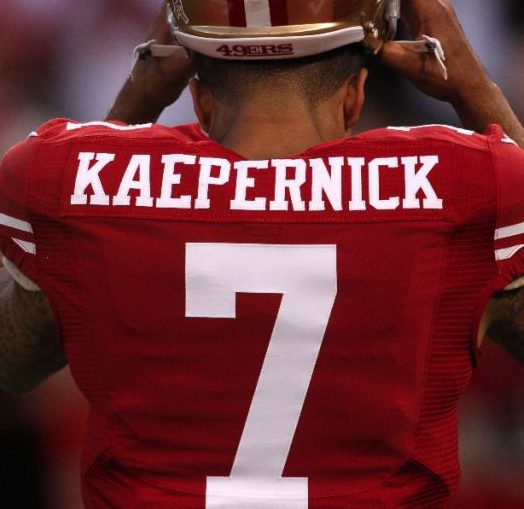 San Francisco 49ers&#039 Colin Kaepernick smiles during NFL football training camp Sunday