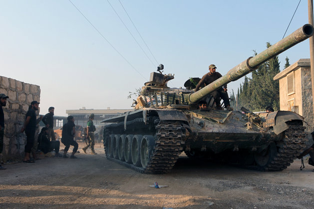 Ammar Abdullah  Reuters
Rebel fighters ride a tank in an artillery academy of Aleppo Syria