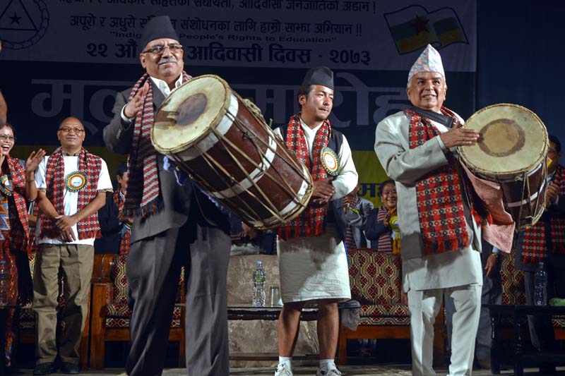 Pushpa Kamal Dahal and Ram Chandra Paudel play a traditional instrument