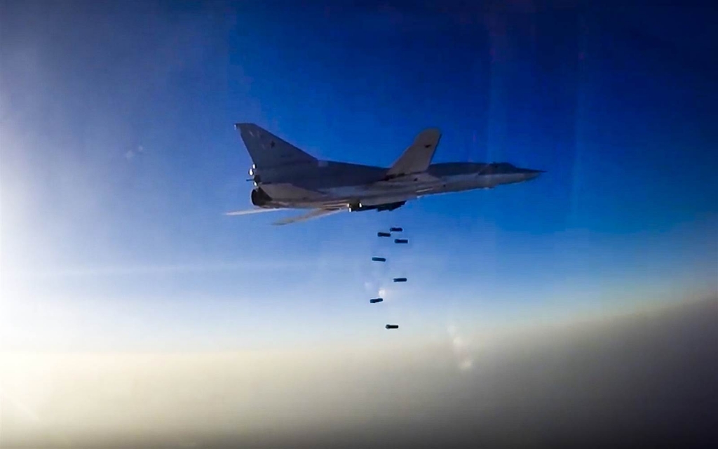 Image An image provided by Russia's defense ministry shows a Russian Tu-22 M3 bomber during an air strike over Aleppo Syria on Tuesday