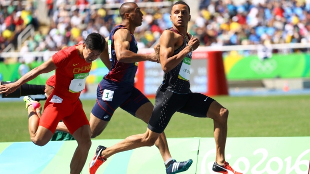 Andre De Grasse competes alongside Su Bingtian of China and Jimmy Vicaut of France during the men's 100-metre preliminaries