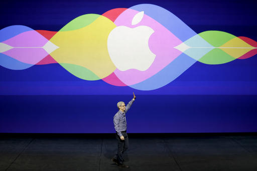 Apple CEO Tim Cook waves during the Apple event at the Bill Graham Civic Auditorium in San Francisco. Apple is expected to unveil some new additions to its current family of iPhone and iPad devices at