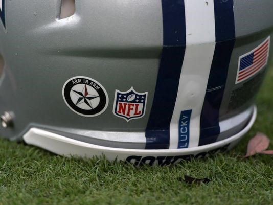 Arm in Arm decal on Cowboys helmet