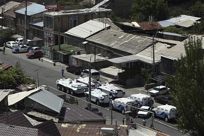 Armenian police and special forces block a street leading to the area around the police station in Yerevan