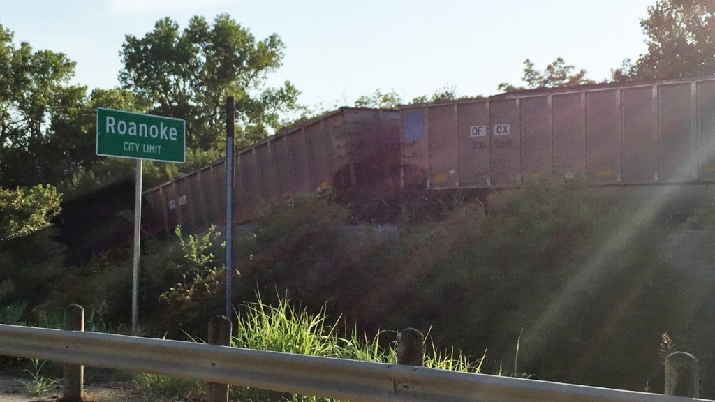 Around 20 railcars derailed with several falling into a creek Sunday evening on Highway 377 near Roanoke