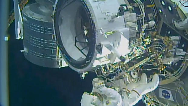 Spacewalkers attach new docking port to station