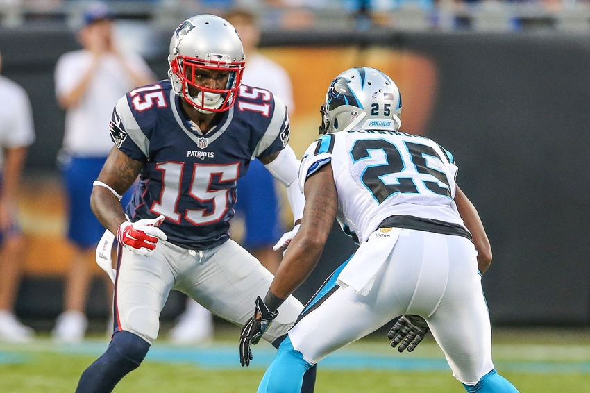 Aug 28 2015 Charlotte NC USA New England Patriots wide receiver Reggie Wayne tries to get past Carolina Panthers cornerback Bene Benwikere