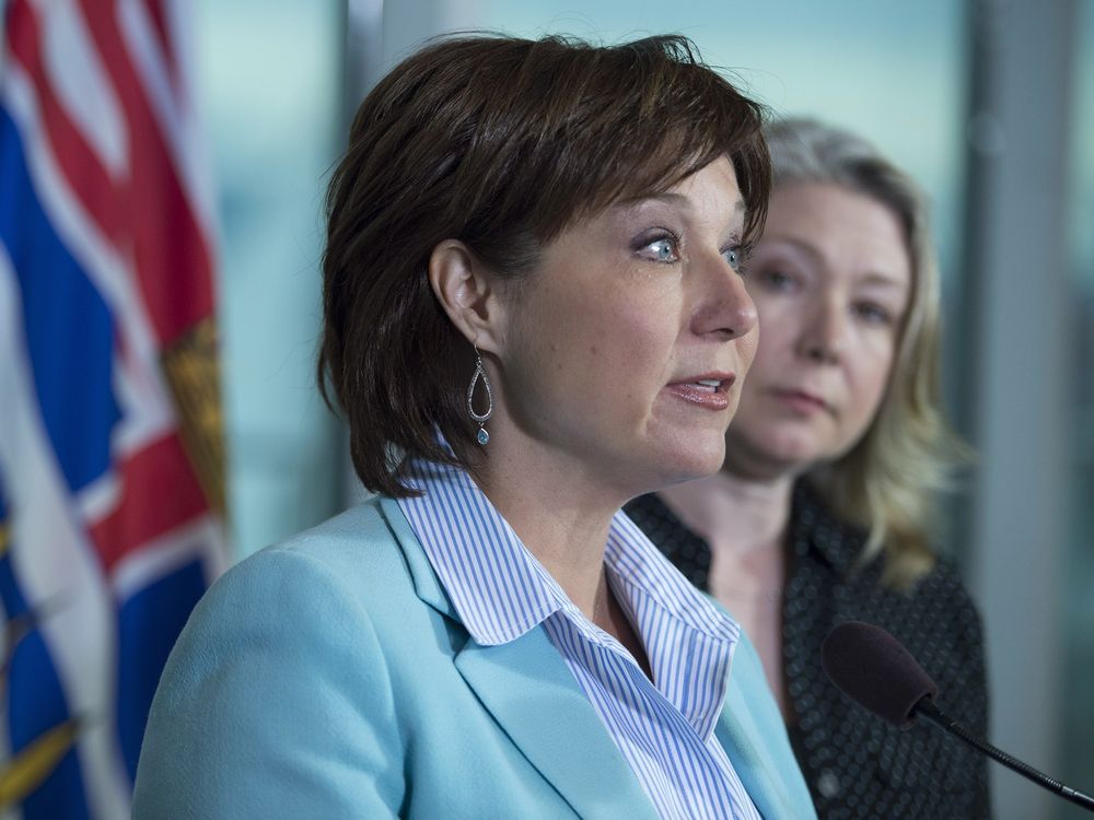 B.C. Premier Christy Clark addresses an April 2015 news conference in Vancouver on an environmental issue — an oil spill into English Bay — while provincial environment minister Mary Polak watches