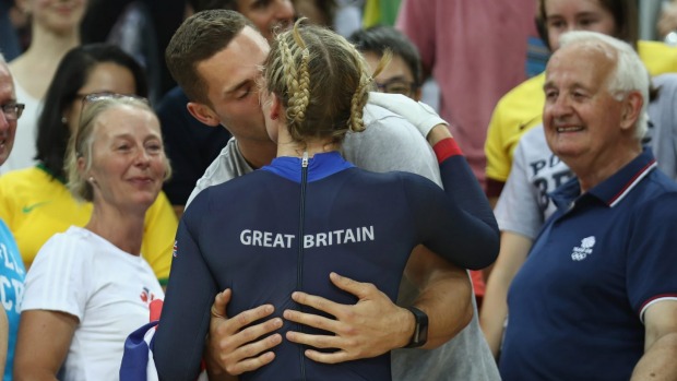 British cyclist Becky James celebrates her silver medal with a kiss with rugby star George North