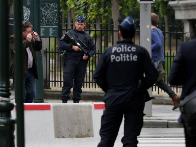 Belgian police officers patrol in central Brussels Belgium