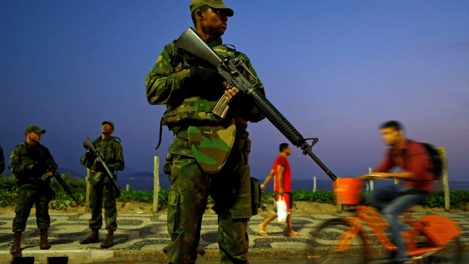 Brazilian soldiers patrol along Ipanema Beach ahead of the 2016 Olympic Games in Rio de Janeiro