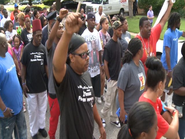 Car hits protester in Ferguson, shots ring out