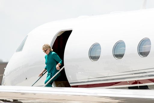 Democratic presidential candidate Hillary Clinton arrives at Des Moines International Airport in Des Moines Wednesday Aug. 10 2016. Clinton is in town to tour Raygun a printing design and clothing company and attend a campaign rally. (AP