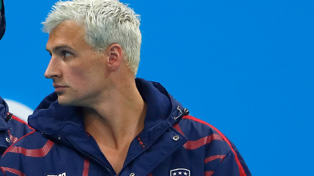 US swimmer Guards pulled guns wanted money