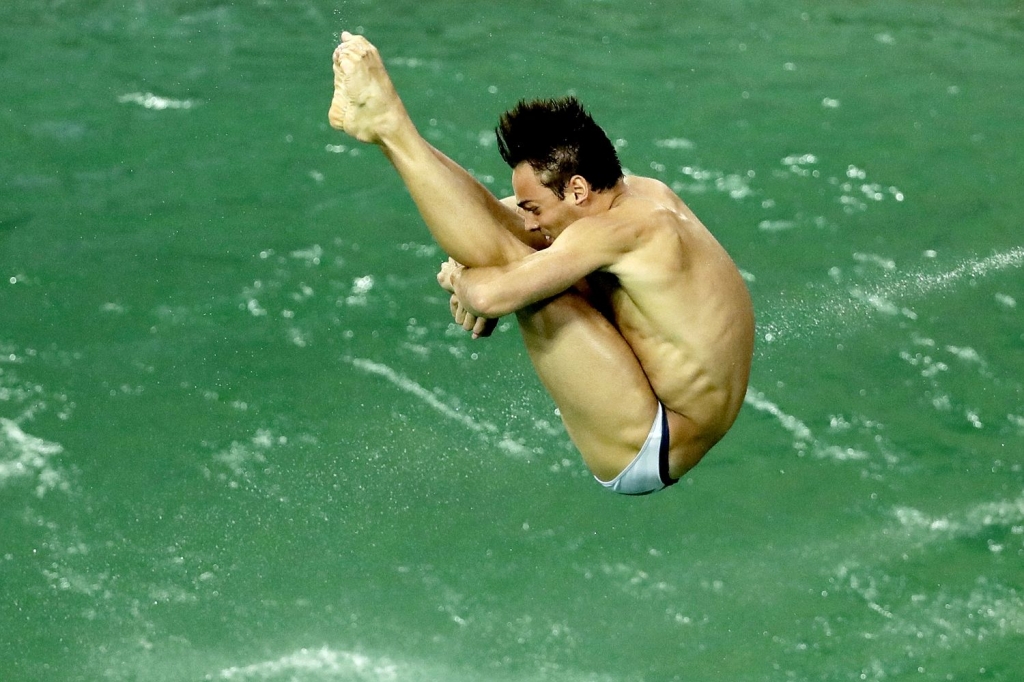 Daley trains in the green waters of the Maria Lenk Aquatic Centre before the pool was closed by organisers Matt Dunham  AP