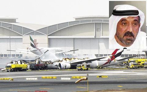 DUBAI A Boeing 777 of the UAE airliner Emirates is seen after it caught fire following a crash-landing at Dubai airport yesterday. Emirates CEO Sheikh Ahmed bin Saeed Al Maktoum gives a press conference near the airport yesterday. — AFP