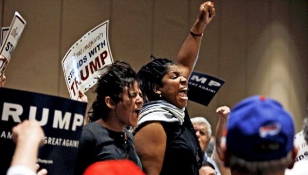 Demonstrators shout as they protest Donald Trump at a campaign rally in Tampa Florida