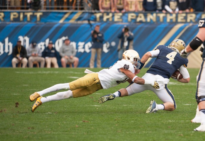 Irish senior safety Max Redfield takes down Pittsburgh quarterback Nate Peterman during Notre Dame’s 42-30 win over the Panthers at Heinz Field in Pittsburgh. Redfield was one of six Irish players arrested overnight in two separate incidents