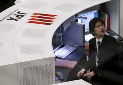 Employees of the Tokyo Stock Exchange work at the bourse in Tokyo Japan