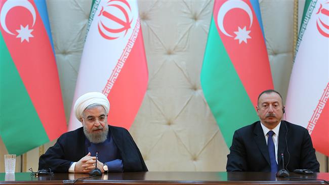 Iranian President Hassan Rouhani speaks at a joint press conference with his Azeri counterpart Ilham Aliyev in Baku