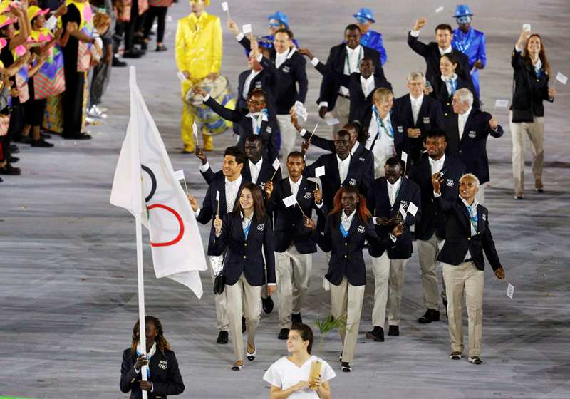 Flagbearer Rose Nathike Lokonyen of the Refugee Olympic Athletes leads her contingent during the opening ceremony