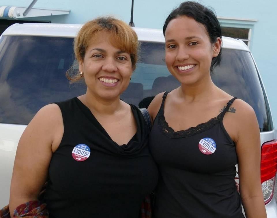 Florida Latinas Maria Lozano and Gabriella Genao vote for Hillary Clinton during the primary election in March