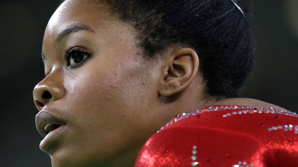 United States&#39 Gabrielle Douglas rests after her floor routine during the gymnastics women's qualification at the 2016 Summer Olympics in Rio de Janeiro Brazil Sunday Aug. 7 2016