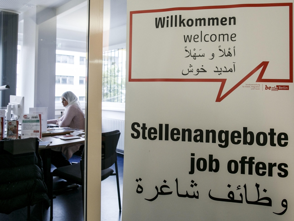 Job consultant Saskia Ben jemaa sits in a welcome center for immigrants on Aug. 18 in Berlin. The center assists immigrants and refugees with asylum status in finding jobs housing and qualification recognition of their previous employment and education