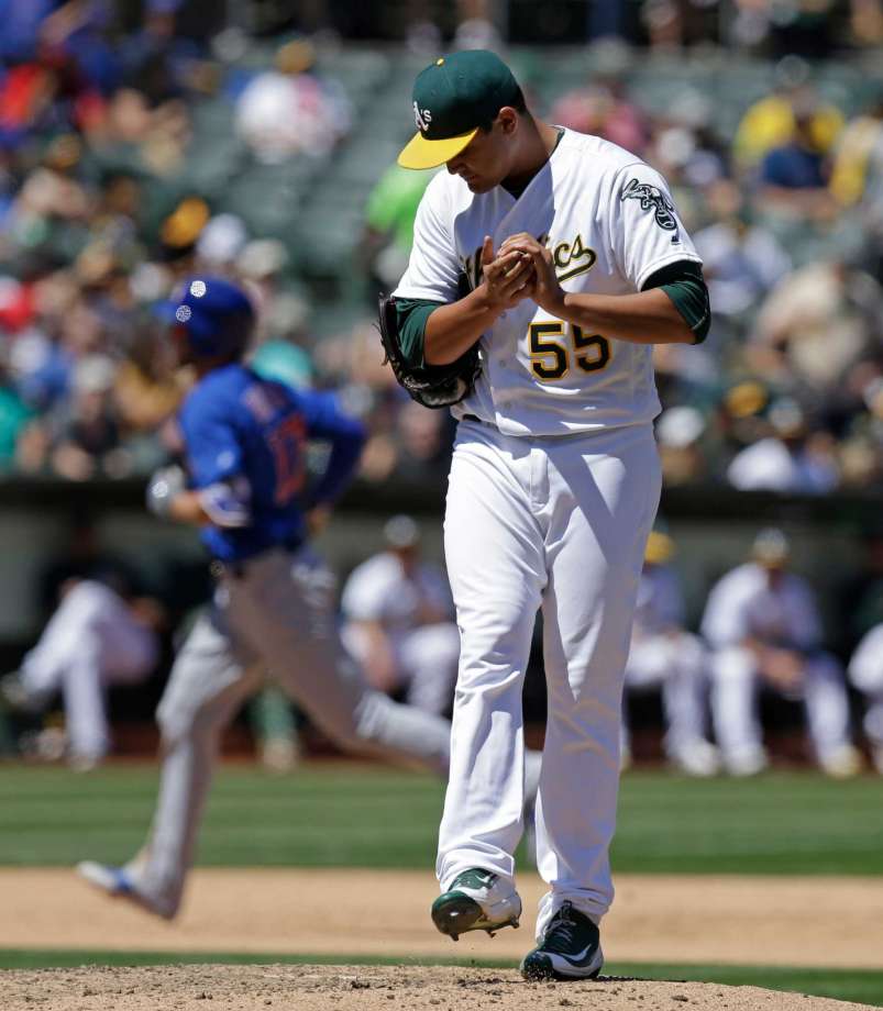 Oakland Athletics pitcher Sean Manaea waits for Chicago Cubs Kris Bryant to run the bases left after Bryant hit a home run in the sixth inning of a baseball game Sunday Aug. 7 2016 in Oakland Calif