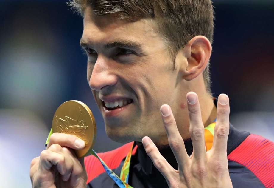 United States Michael Phelps celebrates winning the gold medal in the men's 200-meter individual medley during the swimming competitions at the 2016 Summer Olympics Thursday Aug. 11 2016 in Rio de Janeiro Brazil