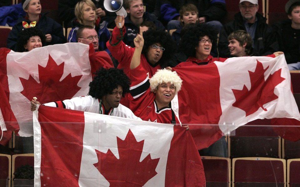 Supporters of the Canadian team wave the