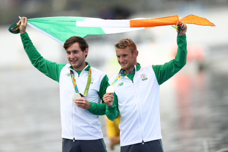 Paul O'Donovan and brother Gary O'Donovan of Ireland celebrate after the medal ceremony for the Lightweight Men's Double Sculls