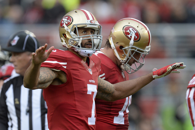 San Francisco 49ers quarterback Colin Kaepernick gestures to the crowd to be quiet as he takes the field against the Atlanta Falcons in the fourth quarter of their NFL game at Levi's Stadium in Santa Clara Calif. on Sunday Nov. 8 2015. San Francis