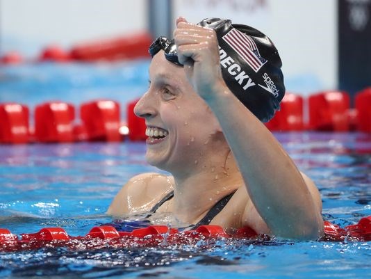 Katie Ledecky celebrates after winning the women's 800-meter freestyle