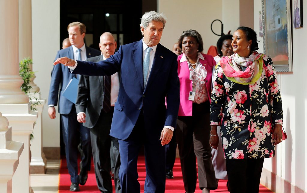 U.S. Secretary of State John Kerry talks to Kenya's Foreign Affairs Cabinet Secretary Amina Mohamed as he arrives at the State House in Kenya's capital Nairobi on Aug. 22